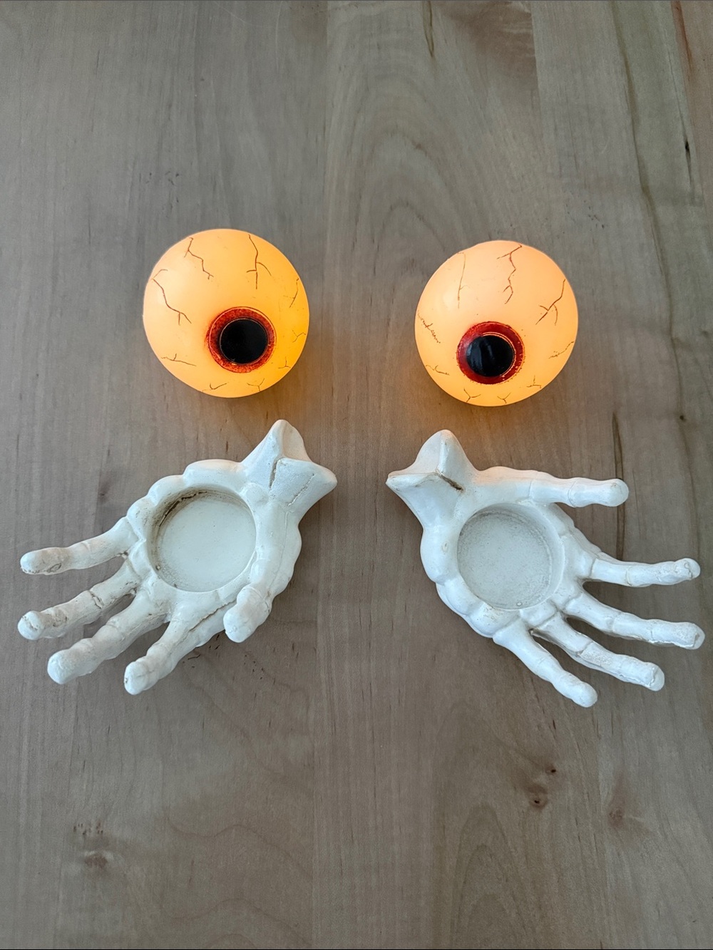 Skeleton Hand Tea Light Holders with Glowing Orange Eyeball Accents